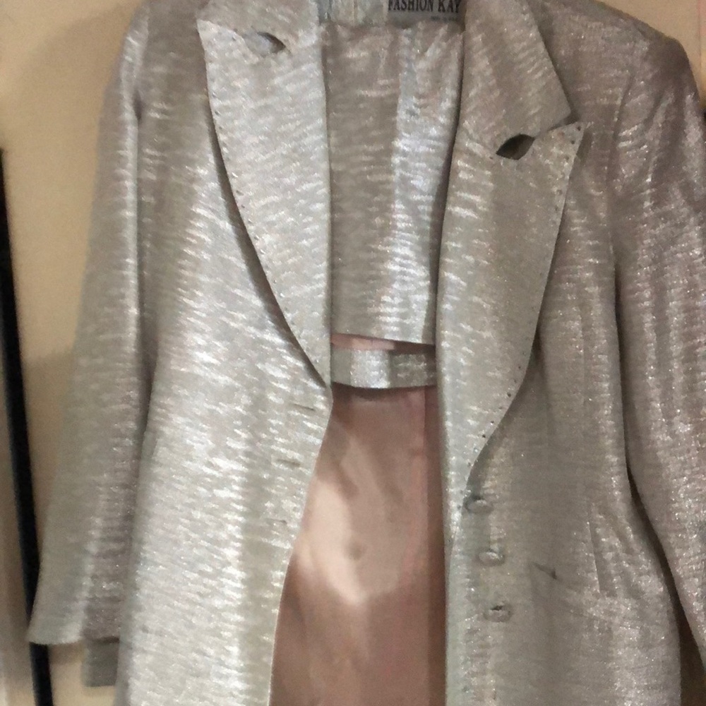 Beautiful 2 piece sequined silver skirt suit.